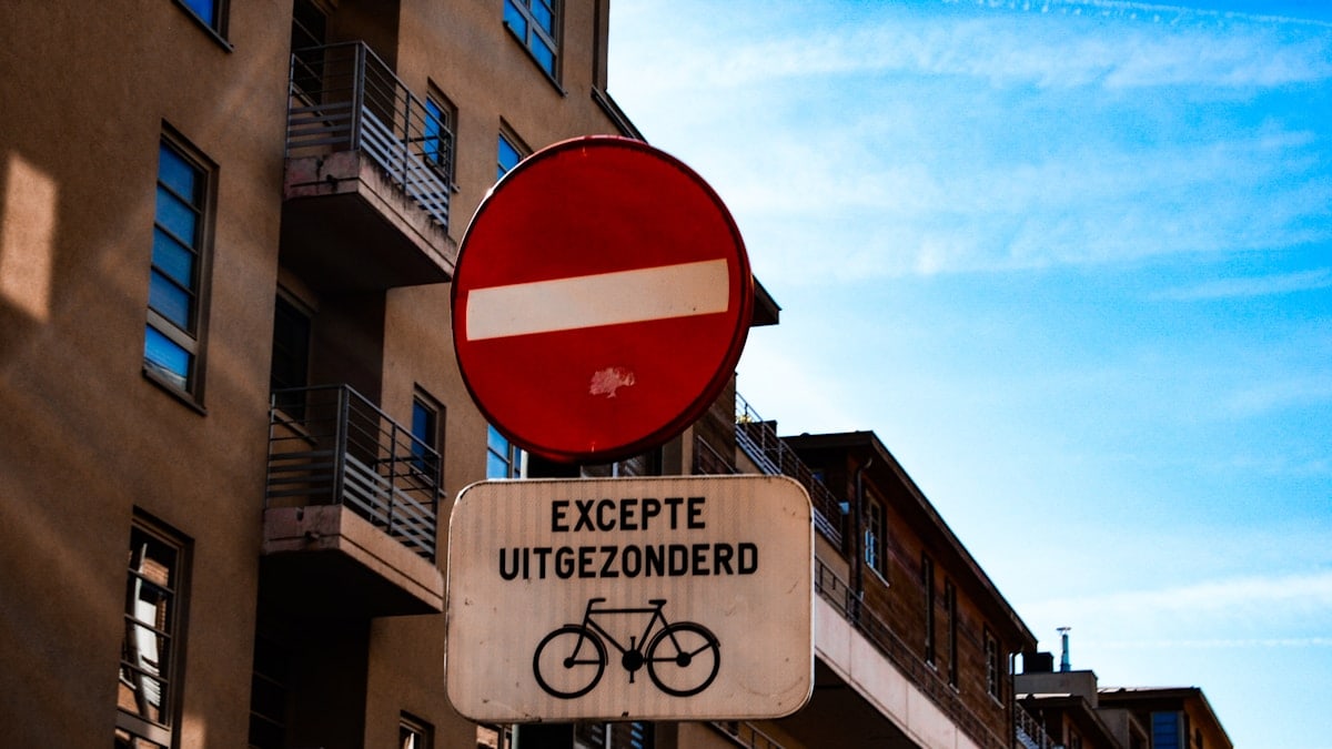 white and black Excepte Uitgezonderd signage during daytime